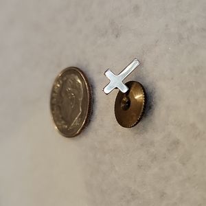 Yellow metal cross lapel pin